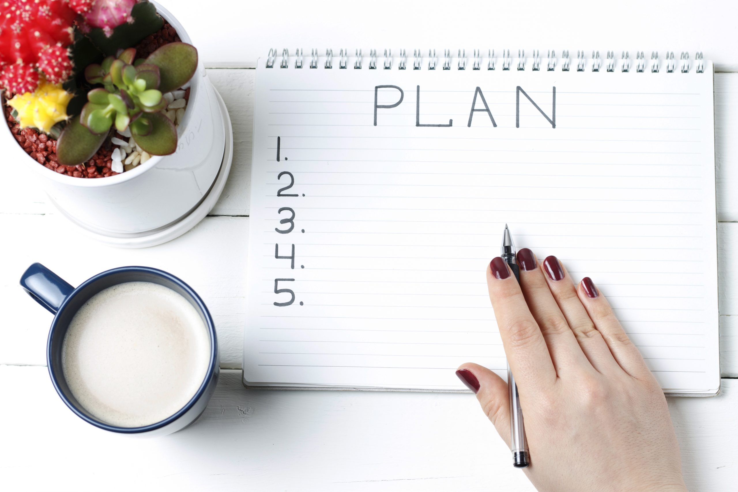 Inscription Plan in notepad, close-up, top view, concept of planning, goal setting