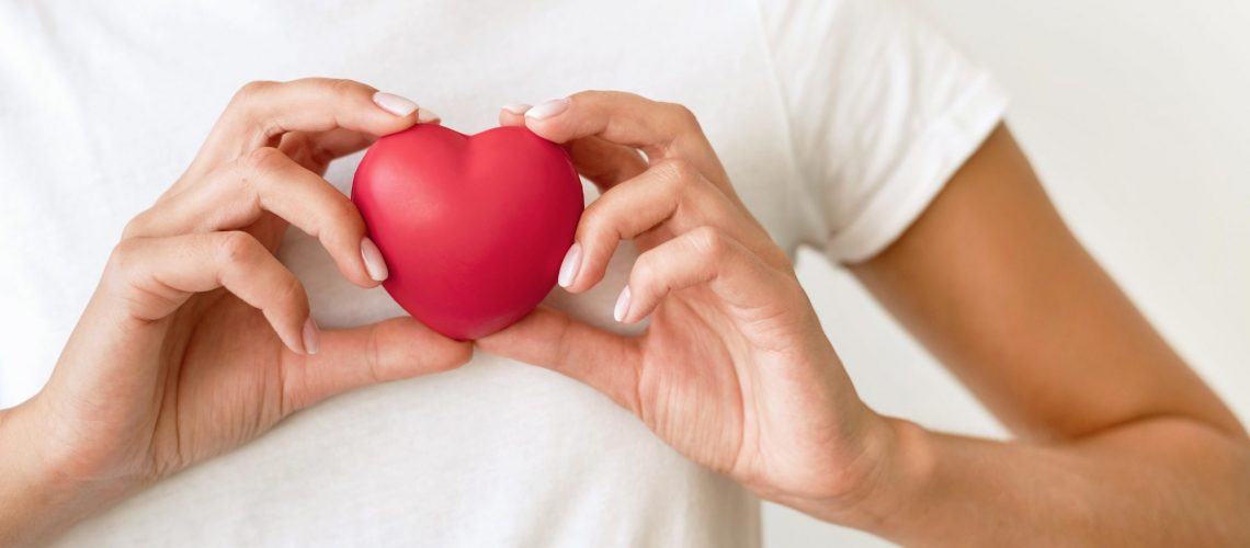 front-view-of-woman-holding-heart-shape